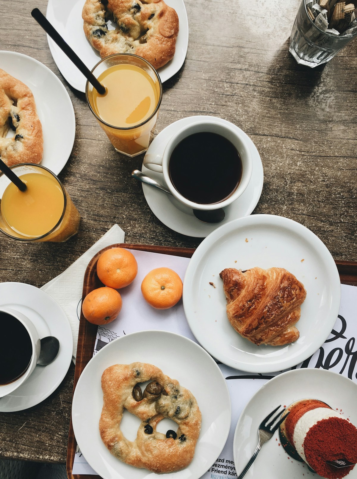 Continental breakfast with croissants, bread and coffee